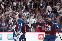 DENVER, COLORADO - JUNE 18: Darcy Kuemper #35 of the Colorado Avalanche celebrates a win with Erik Johnson #6 of the Colorado Avalanche over the Tampa Bay Lightning in Game Two of the 2022 NHL Stanley Cup Final at Ball Arena on June 18, 2022 in Denver, Colorado. (Photo by Harry How/Getty Images)