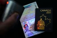 The new Canadian passport is unveiled at an event at the Ottawa International Airport in Ottawa on Wednesday, May 10, 2023. THE CANADIAN PRESS/Sean Kilpatrick