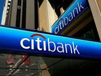 FILE PHOTO: People walk beneath a Citibank branch logo in the financial district of San Francisco, California July 17, 2009. REUTERS/Robert Galbraith/File Photo/File Photo