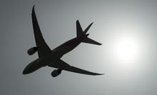 A plane is silhouetted as it takes off from Vancouver International Airport in Richmond, B.C., Monday, May 13, 2019. The first commercial flights offered free of charge to Ukrainians through fundraising using Aeroplan points and cash will not be available until June. THE CANADIAN PRESS/Jonathan Hayward