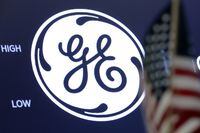FILE - In this June 26, 2018, file photo the General Electric logo appears above a trading post on the floor of the New York Stock Exchange. GE Appliances announced plans Thursday, Oct. 28, 2021, to add more than 1,000 jobs at its sprawling Kentucky operations as part of a $450 million investment to boost capacity and launch new products. (AP Photo/Richard Drew, File)