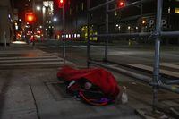 A homeless man sleeps on the street, in Toronto, on Friday, March 11, 2022. Two advocates who work with Toronto's homeless community say they have observed an alarming uptick in violent physical and verbal attacks against the vulnerable population over the last several months. THE CANADIAN PRESS/Chris Young