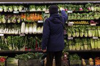 Almost two-thirds of Canadians say they have switched their primary grocery store in the past year to score better deals. A customer shops for produce at a grocery store In Toronto on Friday, Feb. 2, 2024. THE CANADIAN PRESS/Cole Burston