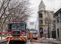 Firefighters are shown at the scene of a fire in Old Montreal, Thursday, March 16, 2023.