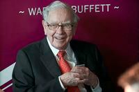 FILE - Warren Buffett, Chairman and CEO of Berkshire Hathaway, smiles as he plays bridge following the annual Berkshire Hathaway shareholders meeting in Omaha, Neb, May 5, 2019. Buffett’s Berkshire Hathaway is buying insurance company Alleghany in a deal valued at approximately $11.6 billion a statement reported Monday, March 21, 2022. (AP Photo/Nati Harnik, File)