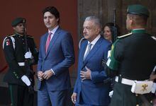 Mexican President Andres Manuel Lopez Obrador walks with Prime Minister Justin Trudeau as he arrives at the National Palace for the North American Leaders Summit Tuesday, January 10, 2023 in Mexico City, Mexico. THE CANADIAN PRESS/Adrian Wyld