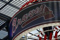 The signature 'Tomahawk chop' of MLB's Atlanta Braves is seen on a digital display outside Truist Park in Atlanta on June 20, 2020