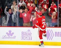 Detroit Red Wings center Dylan Larkin (71) celebrates after scoring in a shootout to defeat the Arizona Coyotes in overtime of NHL hockey game Friday, Nov. 25, 2022, in Detroit. (AP Photo/Duane Burleson)
