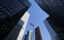 The Canadian flag flutters in the wind at the TD Centre in Toronto’s Financial District, on March 15.