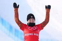 ZHANGJIAKOU, CHINA - FEBRUARY 09: Bronze medallist Meryeta Odine of Team Canada celebrates during the Women's Snowboard Cross flower ceremony on Day 5 of the Beijing 2022 Winter Olympic Games at Genting Snow Park on February 09, 2022 in Zhangjiakou, China. (Photo by Ezra Shaw/Getty Images)