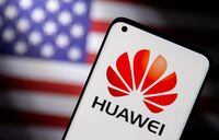 FILE PHOTO: Smartphone with a Huawei logo is seen in front of a U.S. flag in this illustration taken September 28, 2021. REUTERS/Dado Ruvic/Illustration/File Photo
