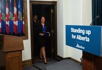 Alberta Premier Danielle Smith makes her way to a press conference after the speech from the throne in Edmonton, Tuesday, Nov. 29, 2022. When the Alberta legislature resumed sitting Tuesday, the first bill introduced by the United Conservative Party government aims to shield the province from federal laws it deems harmful to its interests. THE CANADIAN PRESS/Jason Franson