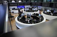 Traders work at the stock exchange in Frankfurt, Germany, on March 20.
