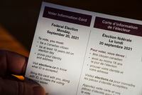 A person holds an Elections Canada voter information card after receiving it in the mail on Tuesday, Aug 31, 2021. Canadians will go to the polls for the federal election on Monday, September 20, 2021. THE CANADIAN PRESS/Sean Kilpatrick