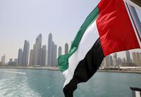 UAE flag flies over a boat at Dubai Marina, Dubai, United Arab Emirates May 22, 2015. REUTERS/Ahmed Jadallah/File Photo