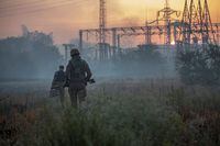 FILE PHOTO: Ukrainian service members patrol an area in the city of Sievierodonetsk, as Russia's attack on Ukraine continues, Ukraine June 20, 2022. REUTERS/Oleksandr Ratushniak