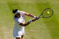 Tunisia's Ons Jabeur returns to Germany's Tatjana Maria in a women's singles semifinal match on day eleven of the Wimbledon tennis championships in London, Thursday, July 7, 2022. (AP Photo/Gerald Herbert)