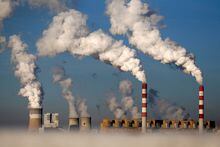 FILE PHOTO: Smoke billows from the chimneys of the Belchatow power station in Belchatow, Poland, October 31, 2013. REUTERS/Kacper Pempel/File Photo