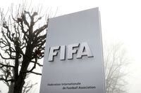 FILE PHOTO: FIFA's logo is seen in front of its headquarters during a foggy autumn day in Zurich, Switzerland November 18, 2020. REUTERS/Arnd Wiegmann/File Photo