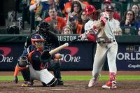 Philadelphia Phillies' Alec Bohm hits a double during the ninth inning in Game 2 of baseball's World Series between the Houston Astros and the Philadelphia Phillies on Saturday, Oct. 29, 2022, in Houston. (AP Photo/Sue Ogrocki)
