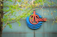 FILE PHOTO: The logo of China National Offshore Oil Corp (CNOOC) is pictured at its headquarters in Beijing, China April 4, 2018. REUTERS/Stringer/File Photo  ATTENTION EDITORS - THIS IMAGE WAS PROVIDED BY A THIRD PARTY. CHINA OUT. NO COMMERCIAL OR EDITORIAL SALES IN CHINA. GLOBAL BUSINESS WEEK AHEAD