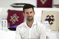 Serbian tennis star Novak Djokovic attends a presentation of the Novak Djokovic Foundation in the Serbian pavilion at Dubai Expo 2020, in Dubai, United Arab Emirates, Thursday, Feb. 17, 2022. Djokovic on Thursday received a warm welcome in Dubai, where he visited the world's fair following the global drama around his decision to remain unvaccinated. (AP Photo/Ebrahim Noroozi)