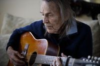 Canadian musician Gordon Lightfoot strums his guitar in his Toronto home on Thursday, April 25, 2019. THE CANADIAN PRESS/Cole Burston