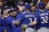 The Texas Rangers celebrate after Game 1 of the baseball AL Championship Series Sunday, Oct. 15, 2023, in Houston. The Rangers won 2-0 to take a 1-0 lead in the series. (AP Photo/David J. Phillip)