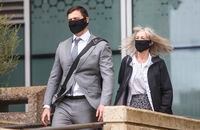 Matthew McKnight and his mother walk out of court during a break in Edmonton on Wednesday, July 8, 2020. McKnight, 33, was accused of sexually assaulting 13 women ranging in age from 17 to 22 between 2010 and 2016. THE CANADIAN PRESS/Jason Franson