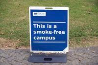 A sign indicates that the University of Aukland campus is smoke-free in Auckland, New Zealand, Thursday, Dec. 9, 2021. New Zealand's government believes it has come up with a unique plan to end tobacco smoking, a lifetime ban for those aged 14 and under. (AP Photo/David Rowland)