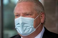 Ontario Premier Doug Ford answers questions after delivering prepared meals at a seniors residence in Toronto on Monday, February 1, 2021. THE CANADIAN PRESS/Frank Gunn