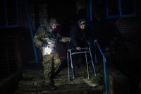 Elderly residents are evacuated from the southern city of Kherson, Ukraine, Sunday, Nov. 27, 2022.&nbsp;Prime Minister Justin Trudeau says $500 million in five-year bonds issued by Canada to support the Ukrainian government have been fully subscribed. THE CANADIAN PRESS/AP-Bernat Armangue