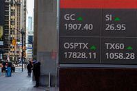 A screen shows a business television channel as Canada's main stock index, the Toronto Stock Exchange's S&P/TSX composite index, rose to a record high in late morning trade in Toronto, Ontario, Canada January 7, 2021.  REUTERS/Carlos Osorio