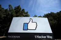 FILE - In this April 14, 2020 file photo, the thumbs up Like logo is shown on a sign at Facebook headquarters in Menlo Park, Calif.