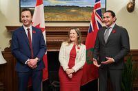 Deputy Prime Minister and Finance Minister Chrystia Freeland, centre, meets with Manitoba Premier Wab Kinew, right, and Manitoba's Minister of Finance Adrien Sala at the Manitoba Legislative Building in Winnipeg on Wednesday, Nov. 8, 2023. The Manitoba government is broadening its plan for a tax holiday on gas and diesel fuel. Sala says the government will amend a bill now before the legislature that will suspend the 14-cent-a-litre fuel tax for at least six months, starting Jan. 1.THE CANADIAN PRESS/David Lipnowski