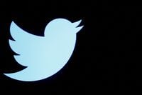 FILE PHOTO: The Twitter logo is displayed on a screen on the floor of the New York Stock Exchange (NYSE) in New York City, U.S., September 28, 2016. REUTERS/Brendan McDermid