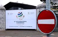 FILE PHOTO: A sign of the 12th Ministerial Conference (MC12) is pictured at the World Trade Organization (WTO) headquarters in Geneva, Switzerland, November 25, 2021. REUTERS/Denis Balibouse