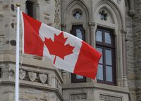 The Canadian flag flies outside the prime minister's office in West Block during a cabinet meeting which the prime minister attended in Ottawa, Wednesday, April 8, 2020. THE CANADIAN PRESS/Adrian Wyld