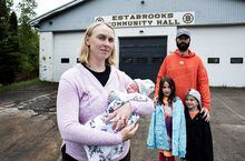 Carolyn Binder holds her 7-day-old baby, Leo with her husband Markus and their two children, Lorelei, 7 and Felix, 5 after visiting the Estabrooks Community Hall in Lewis Lake on Tuesday. They were there to pick-up a few baby items donated to the families who were affected by the recent wildfires in Nova Scotia on June 6, 2023. 