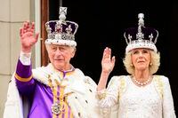 Britain's King Charles III and Queen Camilla wave to the crowds from the balcony of the Buckingham Palace after their coronation, in London, Saturday, May 6, 2023. (Leon Neal/Pool Photo via AP)