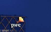 FILE PHOTO: The logo of accounting firm PricewaterhouseCoopers (PwC) is seen on the top of a Brussels' office of the company, in Diegem, Belgium September 21, 2023.  REUTERS/Yves Herman/File Photo