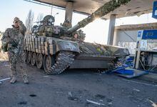 KUPIANSK, UKRAINE - JANUARY 23: Ukrainian soldiers work on a tank on January 23, 2023 in Kupiansk, Ukraine. Kupiansk was occupied by Russian forces mere days after their February 24th invasion of Ukraine, a process hastened by the surrender of Kupiansk's Russia-friendly mayor. Ukrainian forces liberated the town in September, but Russia turned its artillery on Kupiansk while in retreat, causing widespread destruction. (Photo by Spencer Platt/Getty Images)