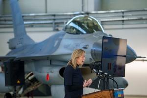 Netherland's Defense Minister Kajsa Ollongren speaks during the inauguration of a F-16 jet pilot training hub at the Baza 86 military air base, outside Fetesti, Romania, Monday, Nov. 13, 2023. NATO member Romania inaugurated an international training hub for F-16 jet pilots from allied countries and other partners, including Ukraine, with airplanes supplied by the Royal Netherlands Air Force, and instructors and maintenance provided by Lockheed Martin, the aircraft maker. (AP Photo/Andreea Alexandru)