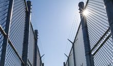 A new report by Ontario's chief coroner says urgent action is needed to fix rapidly deteriorating systemic issues within correctional facilities across the province after the number of inmates that died in custody almost doubled in recent years. Fences with razor wire are shown at Collins Bay Institution in Kingston, Ont., on Tuesday, May 10, 2016. THE CANADIAN/Lars Hagberg