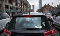 An Uber ride share car arise photographed navigating rush hour traffic on Jarvis St. in downtown Toronto while heading for the highway and roadways out of the city, on May 9 2019.