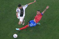 Germany's midfielder #14 Jamal Musiala (L) fights for the ball with Costa Rica's midfielder #14 Youstin Salas (L) during the Qatar 2022 World Cup Group E football match between Costa Rica and Germany at the Al-Bayt Stadium in Al Khor, north of Doha on December 1, 2022. (Photo by François-Xavier MARIT / AFP) (Photo by FRANCOIS-XAVIER MARIT/AFP via Getty Images)