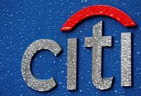 FILE PHOTO: Raindrops are pictured on a signboard of Citibank at its branch in Tokyo, February 23, 2009. Citigroup is in talks that could result in the U.S. government increasing its stake in what was the country's most valuable bank, a source said, and the Wall Street Journal said taxpayers could own as much as 40 percent of the ailing lender's common stock.     REUTERS/Kim Kyung-Hoon (JAPAN)/File Photo