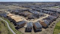 Canada Mortgage and Housing Corp. says the annual pace of housing starts in February rose eight per cent compared with January. New homes are built in a housing construction development in the west-end of Ottawa on Thursday, May 6, 2021. THE CANADIAN PRESS/Sean Kilpatrick