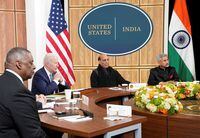 U.S. President Joe Biden, seated with U.S. Defense Secretary Lloyd Austin; India's Defense Minister Rajnath Singh and India's Foreign Minister Subrahmanyam Jaishankar, holds a videoconference with India's Prime Minister Narendra Modi to discuss Russia's war with Ukraine from the White House in  Washington U.S., April 11, 2022. REUTERS/Kevin Lamarque