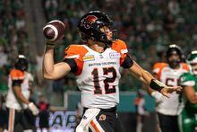 BC Lions Nathan Rourke (12) looks downfield before throwing against Saskatchewan Roughriders during the second quarter of CFL football action in Regina on August 19, 2022. Quarterback Rourke, Toronto linebacker Wynton McManis and Lions receiver Dominique Rhymes are the CFL's top performers for August.THE CANADIAN PRESS/Heywood Yu